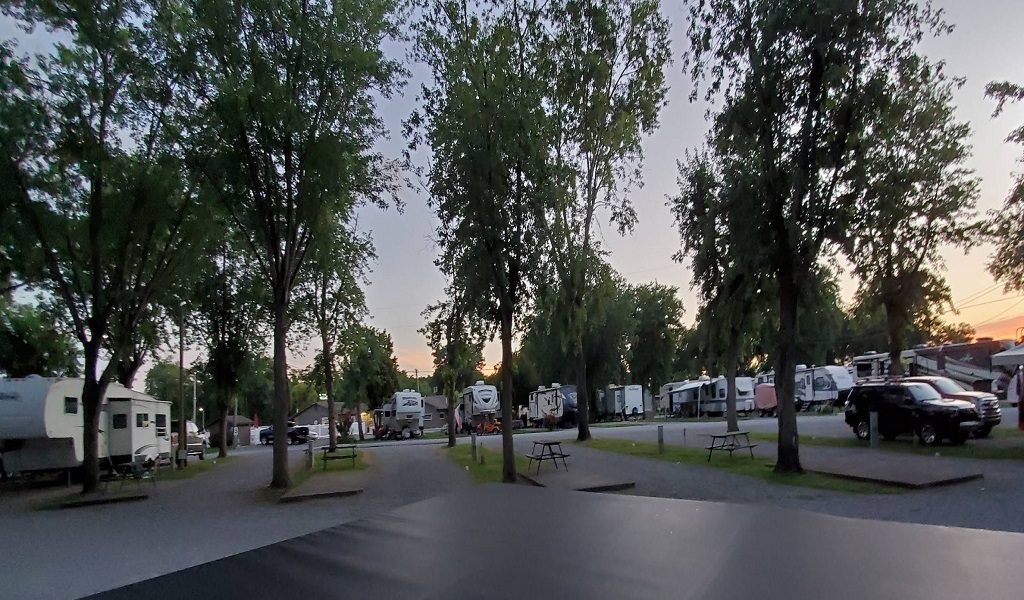 Riverside-RV-Park-7.webp • Concrete RV pads and lake views at Anchor Down RV Resort.